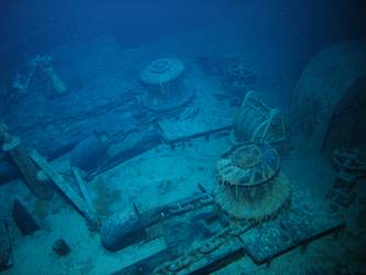 Forecastle capstans and anchor cable secured on deck